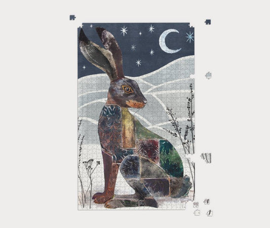Winter Hare jigsaw puzzle with a rabbit design against a night sky with stars and moon.