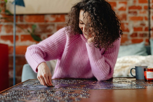 Woman doing a jigsaw puzzle