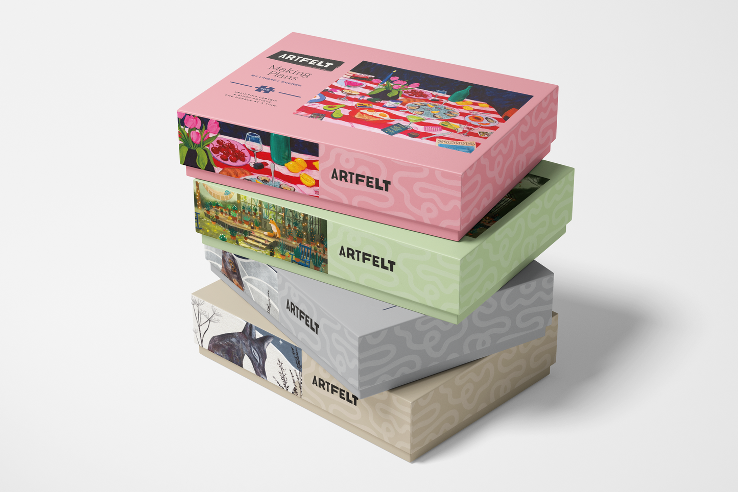 Stack of colorful Artifelt paper boxes on a white background