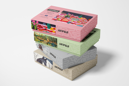 Stack of colorful Artifelt paper boxes on a white background